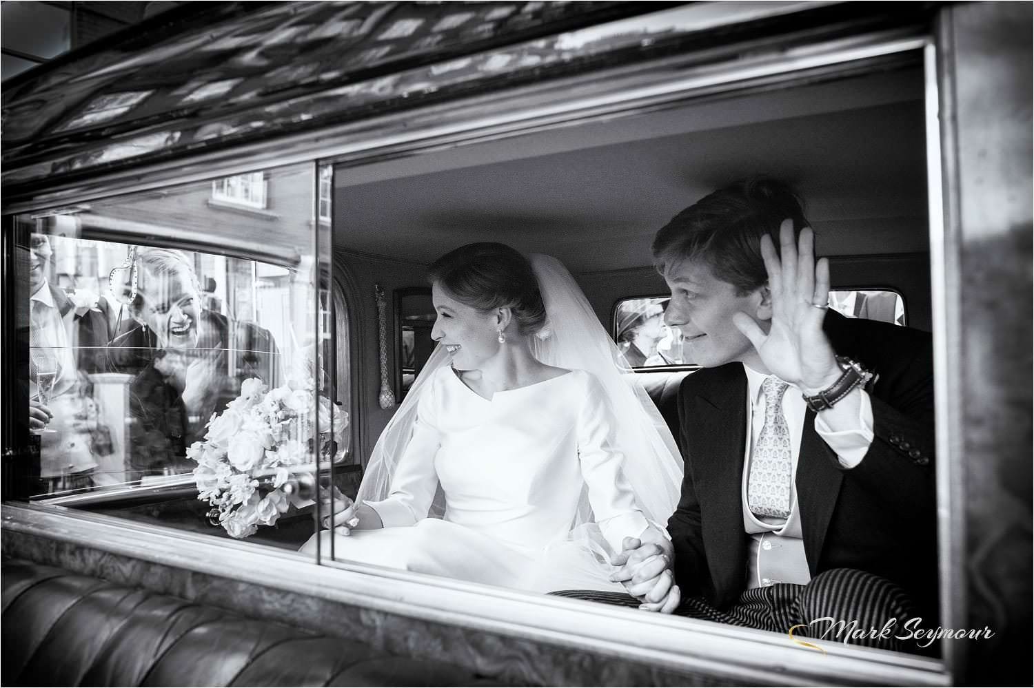Bride and Groom in their wedding car